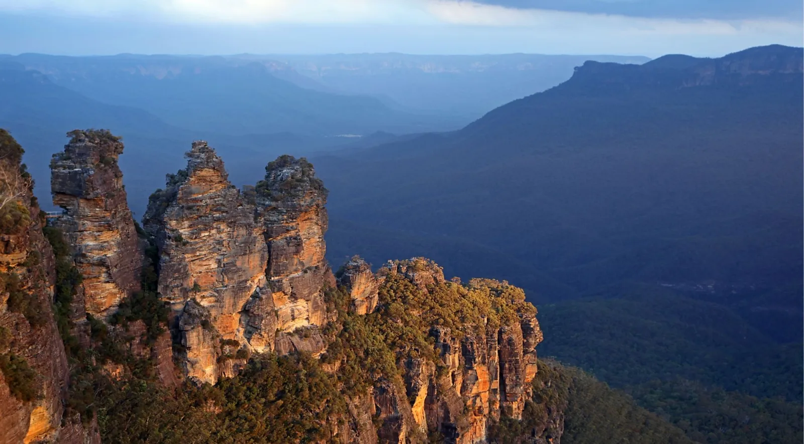 The Three Sisters rock formation rising above Jamison Valley at Echo Point, Katoomba
